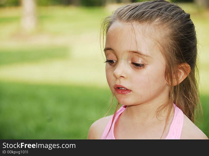 A brunette child looking very serious. A brunette child looking very serious.