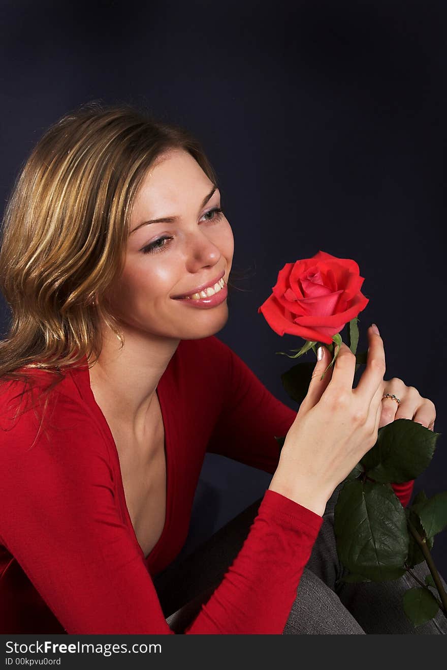 Beautiful young woman with rose