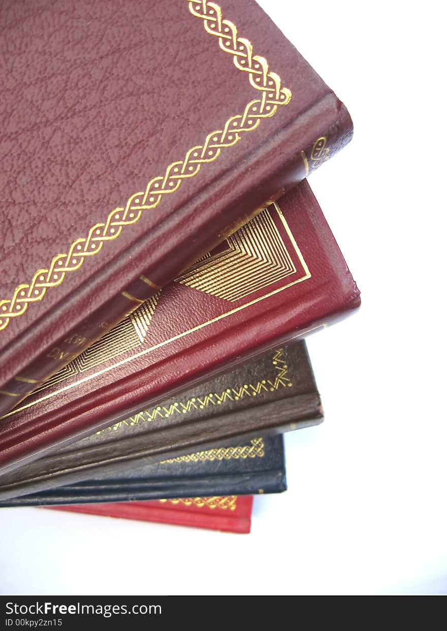 Pile of old books on a white background