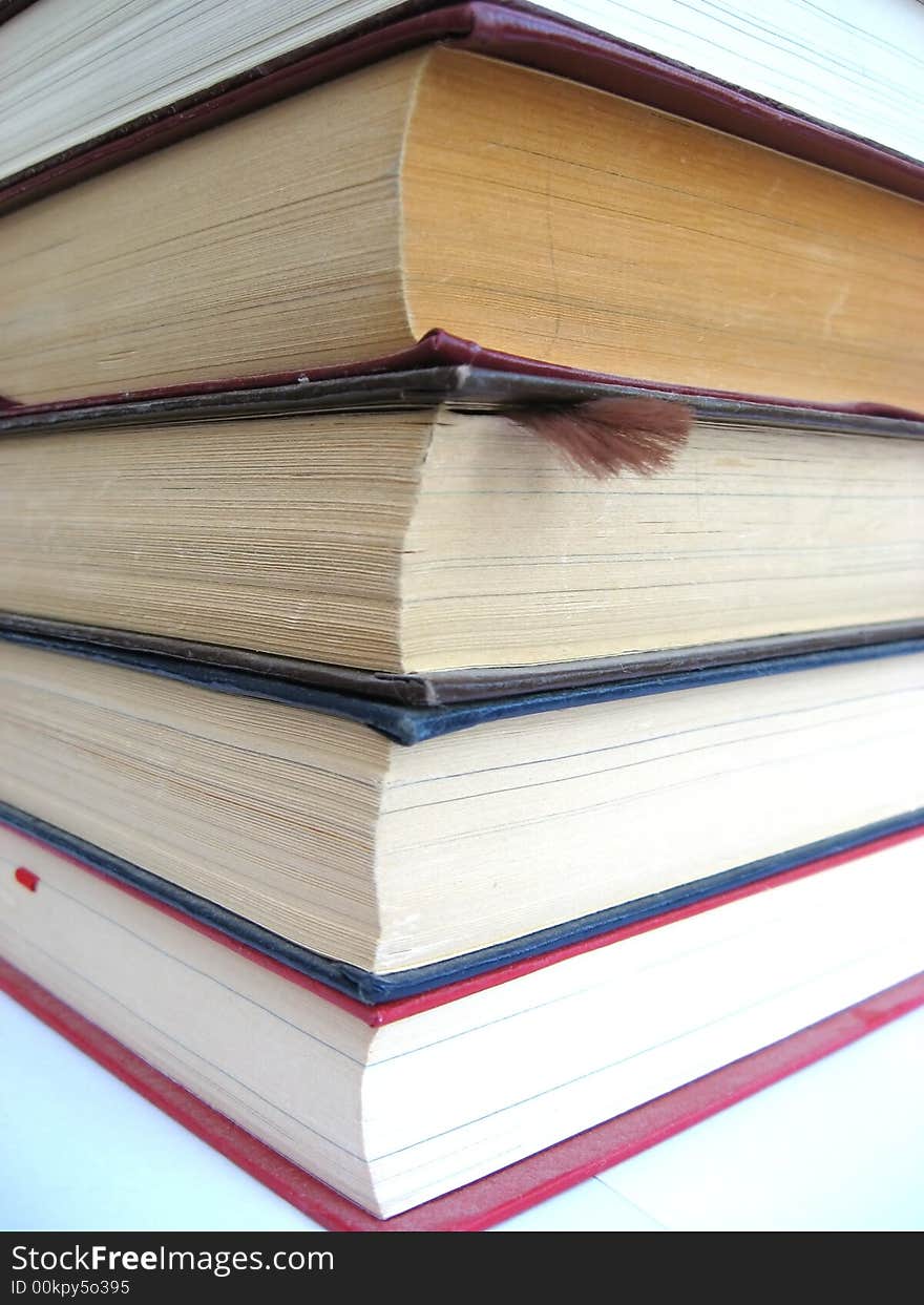 Pile of old books on a white background