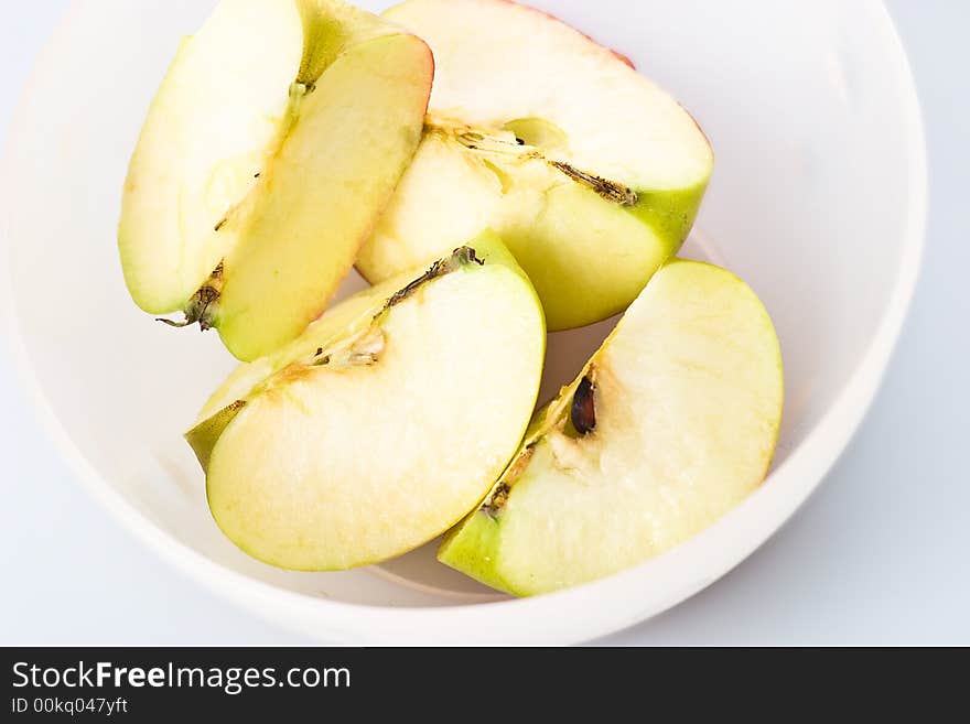 Apple pieces in a bowl.