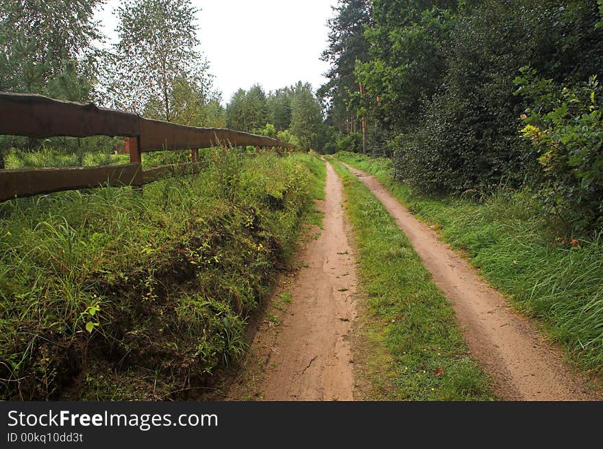 Country road with rainy clouds