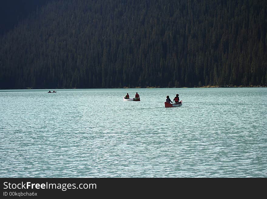 Glacier  blue lake with boats. Glacier  blue lake with boats