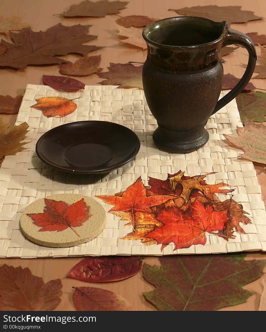 Still life – the  tea-cloth ornamented with leaves - decoupage. Still life – the  tea-cloth ornamented with leaves - decoupage