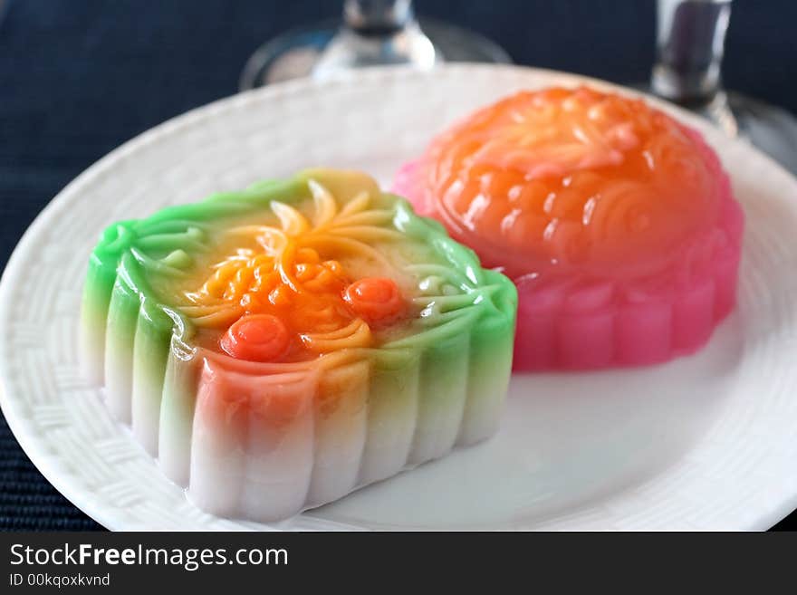 Colorful fruit and egg flavored mooncakes with goldfish patterns signifying prosperity and wealth. Colorful fruit and egg flavored mooncakes with goldfish patterns signifying prosperity and wealth