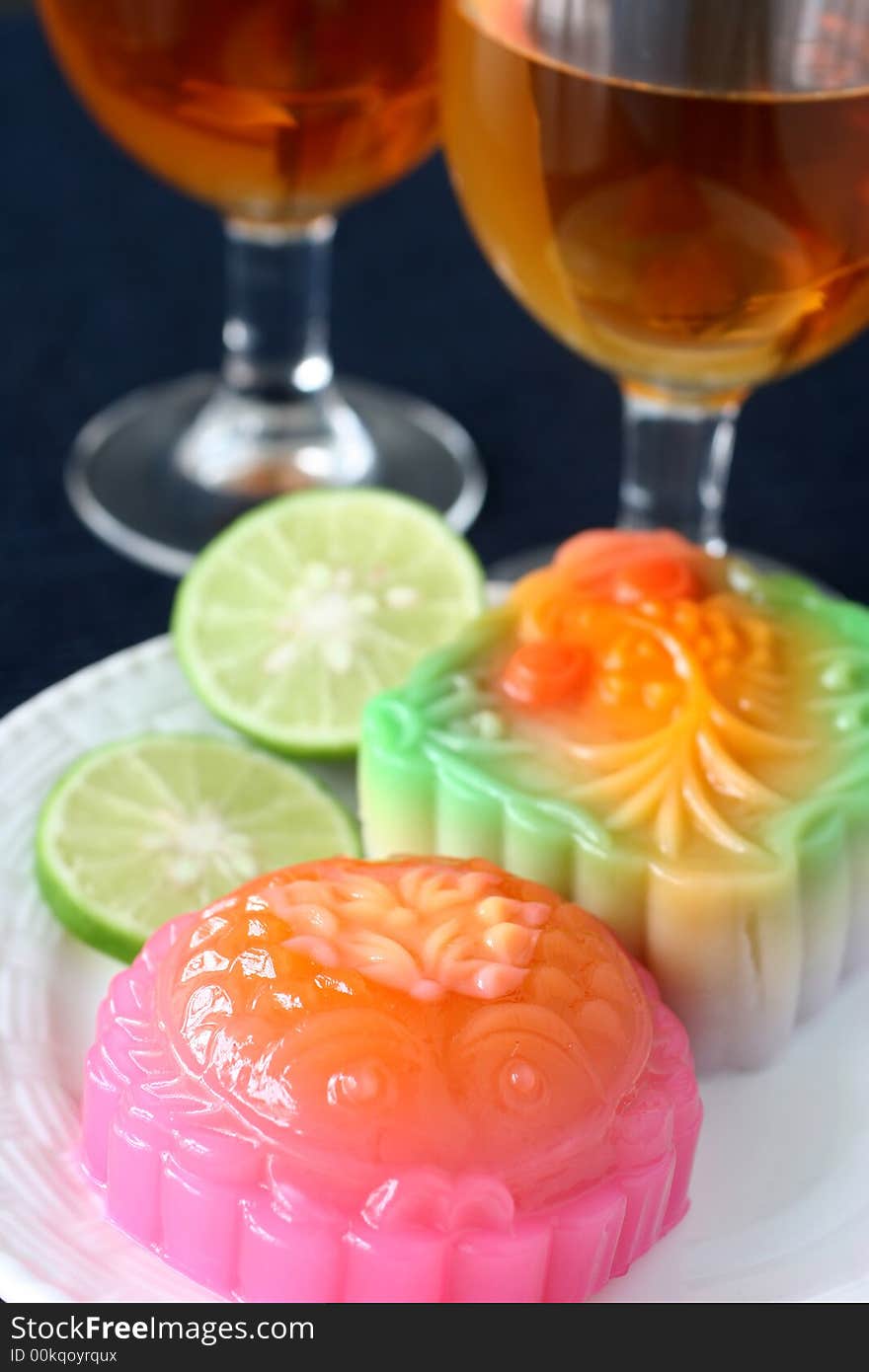 Colorful fruit and egg flavored mooncakes with goldfish patterns signifying prosperity and wealth. Colorful fruit and egg flavored mooncakes with goldfish patterns signifying prosperity and wealth