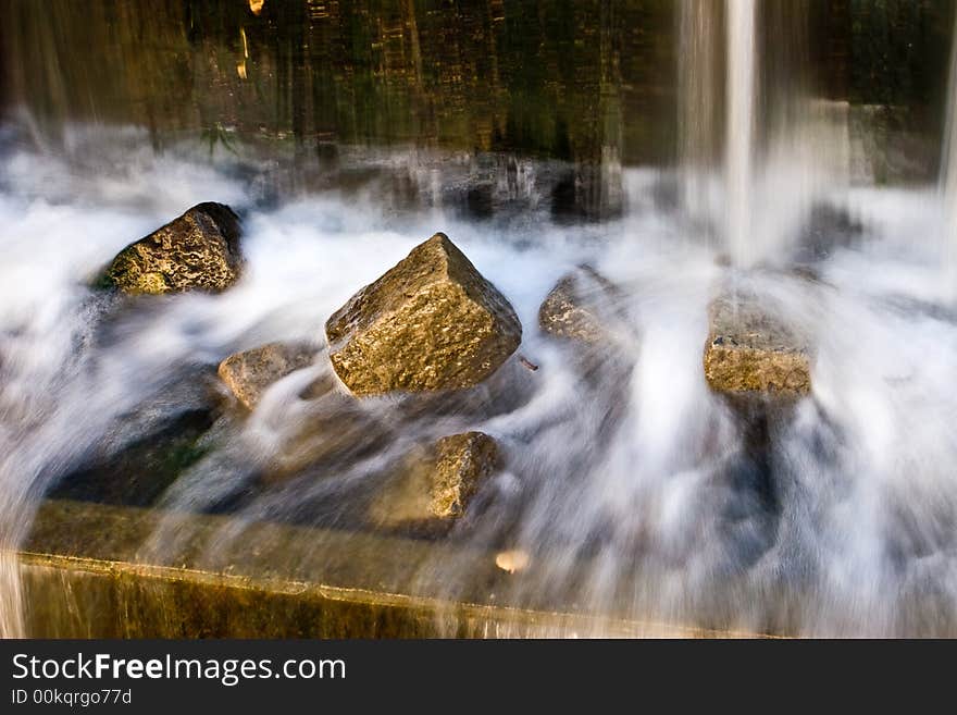 Small waterfall and brilliant stones