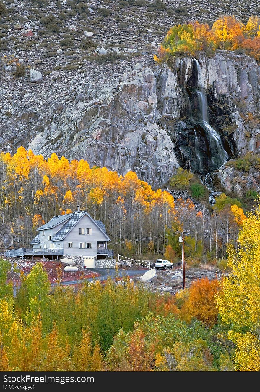 Fall Colored Waterfall and a House