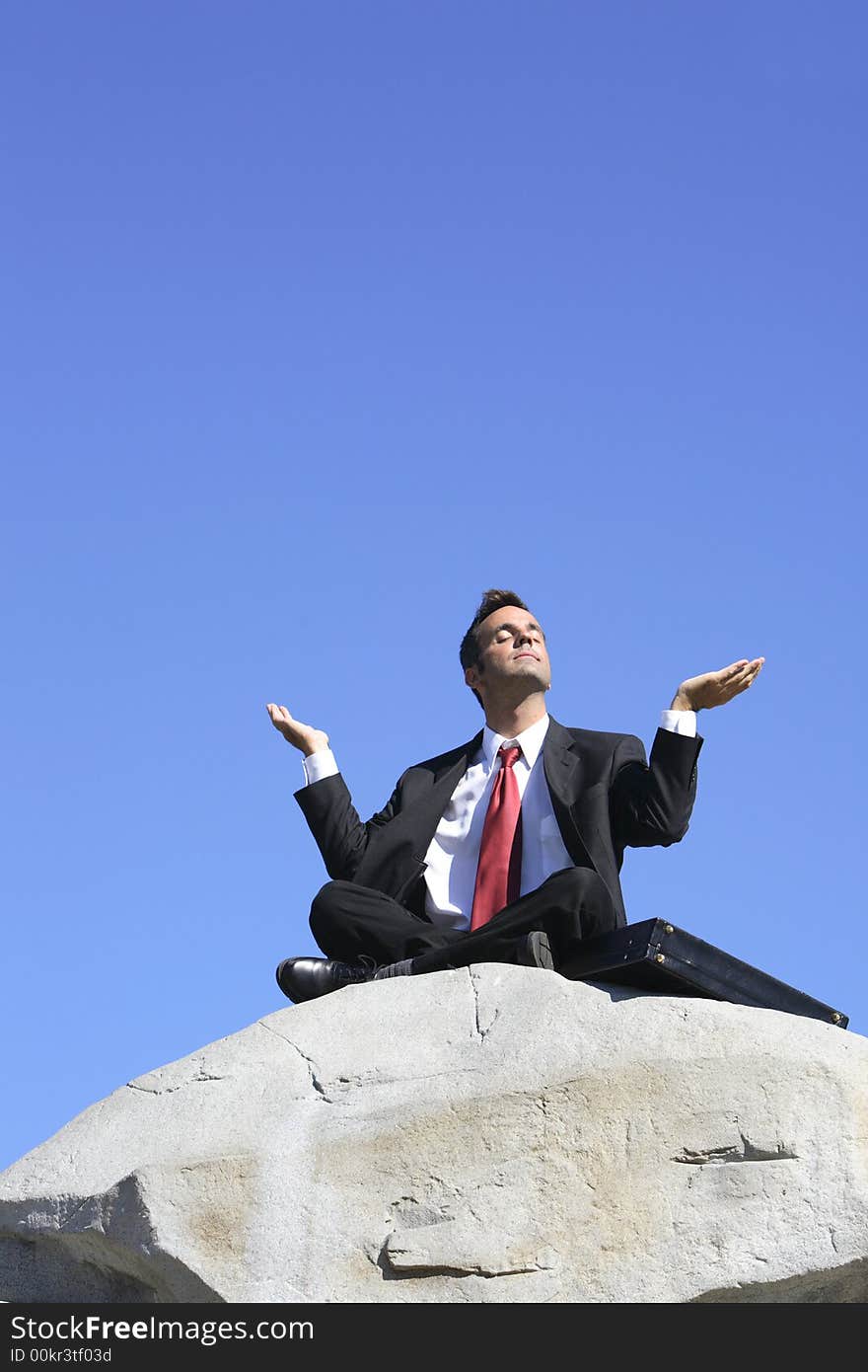 Businessman meditating