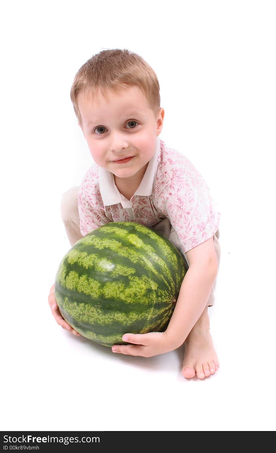 Young boy and watermelon on the white background. Young boy and watermelon on the white background