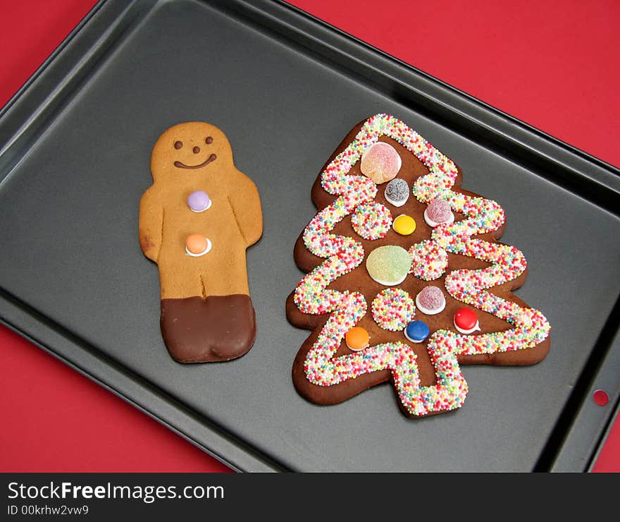 Beautifully decorated gingerbreadman and tree. Beautifully decorated gingerbreadman and tree