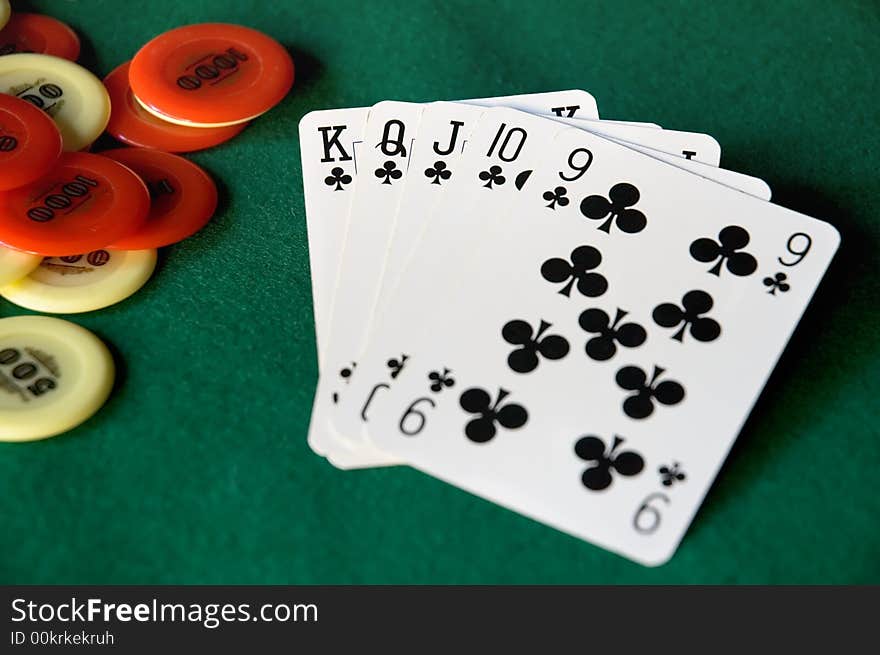 Cards and chips on green table