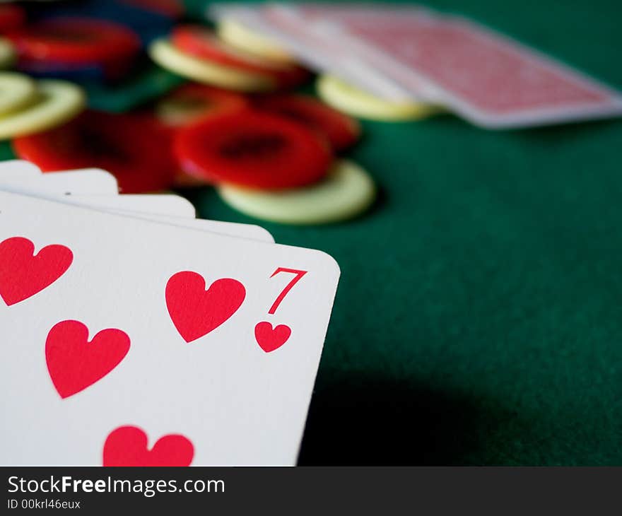 Cards and chips on green table