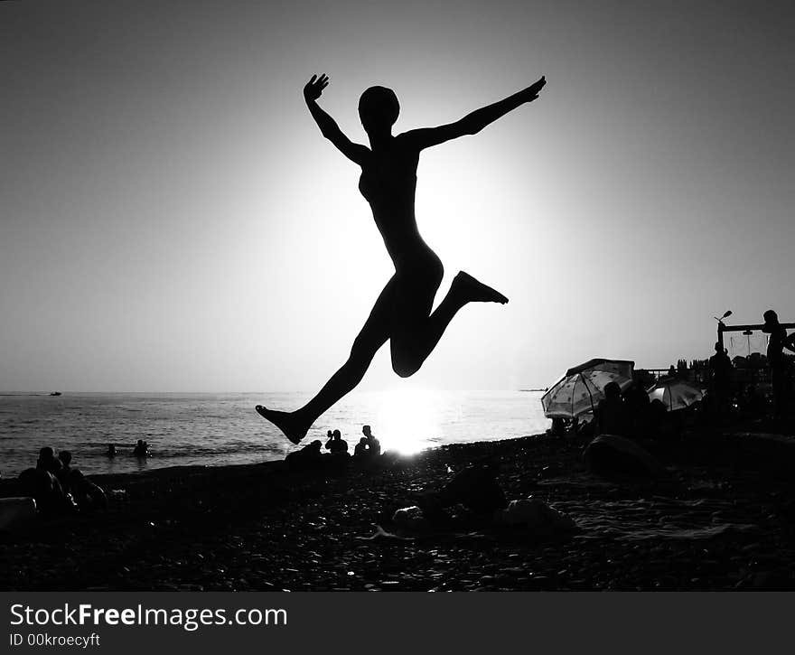 Leap over the girl evening beach. Leap over the girl evening beach