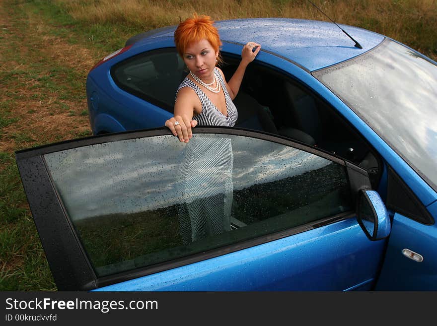 Woman In Dress With Blue Car