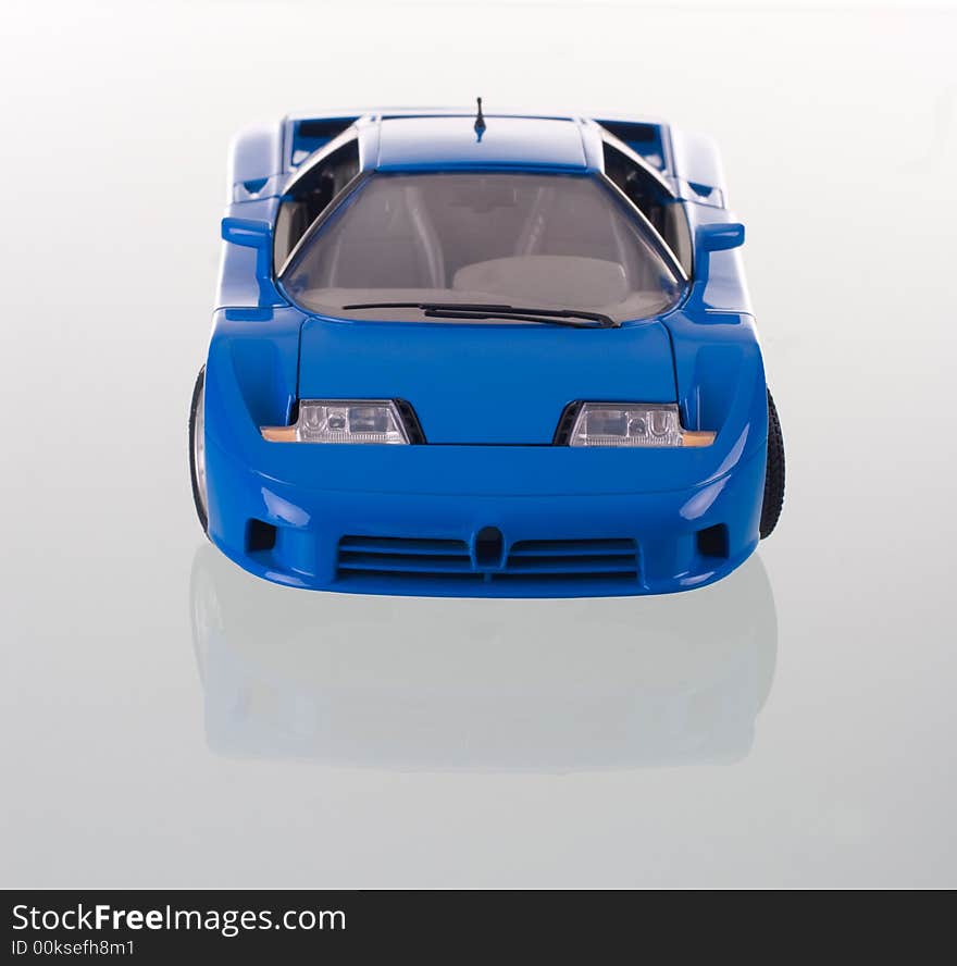 Blue car with reflection. Studio shot. Blue car with reflection. Studio shot