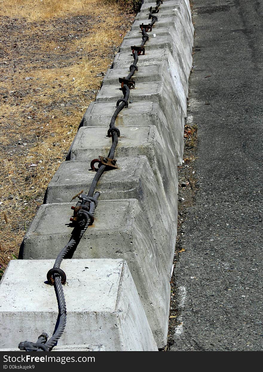 Shot of row of concrete barriers that are attached. Shot of row of concrete barriers that are attached.