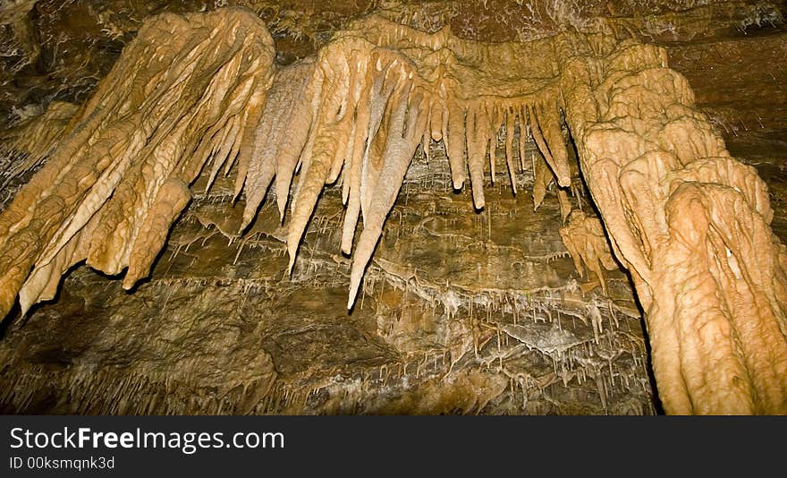 Large sandstone stalactites hang from the ceiling in Smoke Hole Caverns, WV.