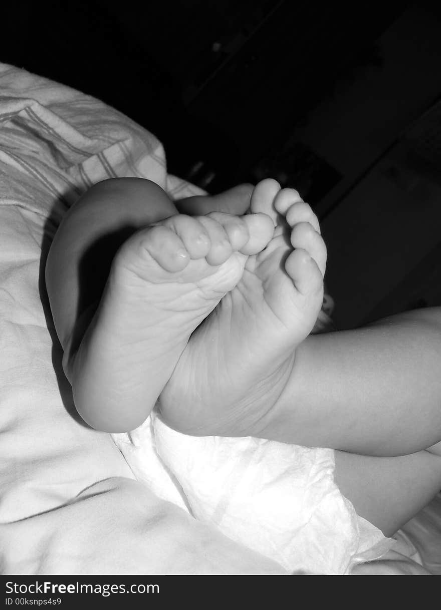 Close-up on feet of baby wearing a diaper. Close-up on feet of baby wearing a diaper