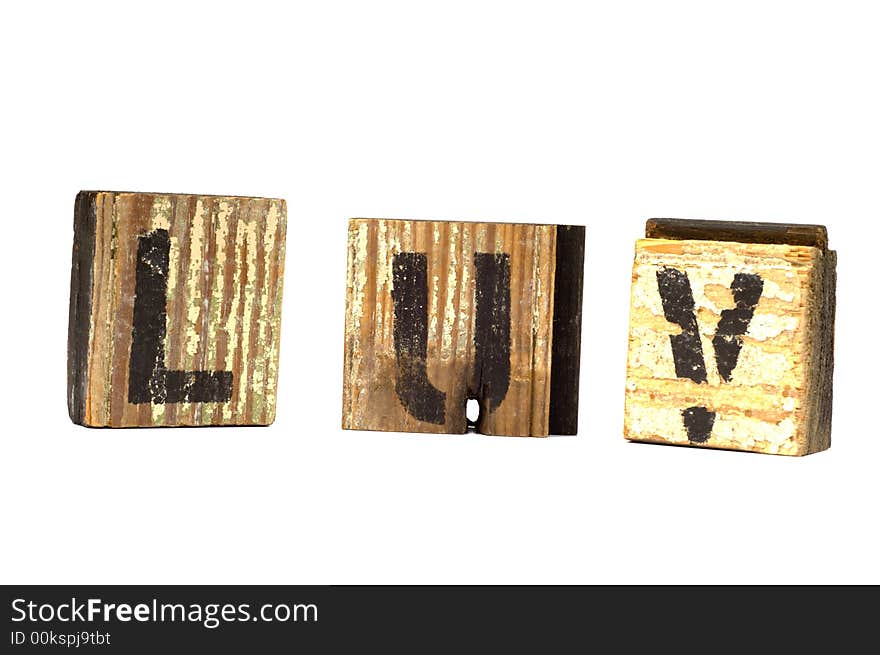 Love decoration with love spelled phonetically on wooden blocks on a white background - possible valentine's day decoration