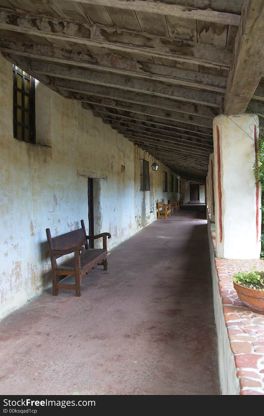 Carmel mission, California - passageway with benches. Carmel mission, California - passageway with benches