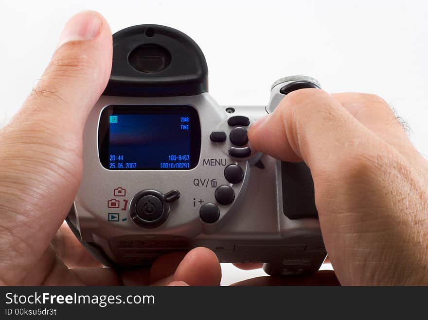 The man holds the digital camera, a close up. The man holds the digital camera, a close up.