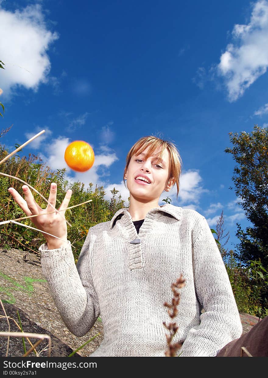 Girl in nature with orange jungling. Girl in nature with orange jungling