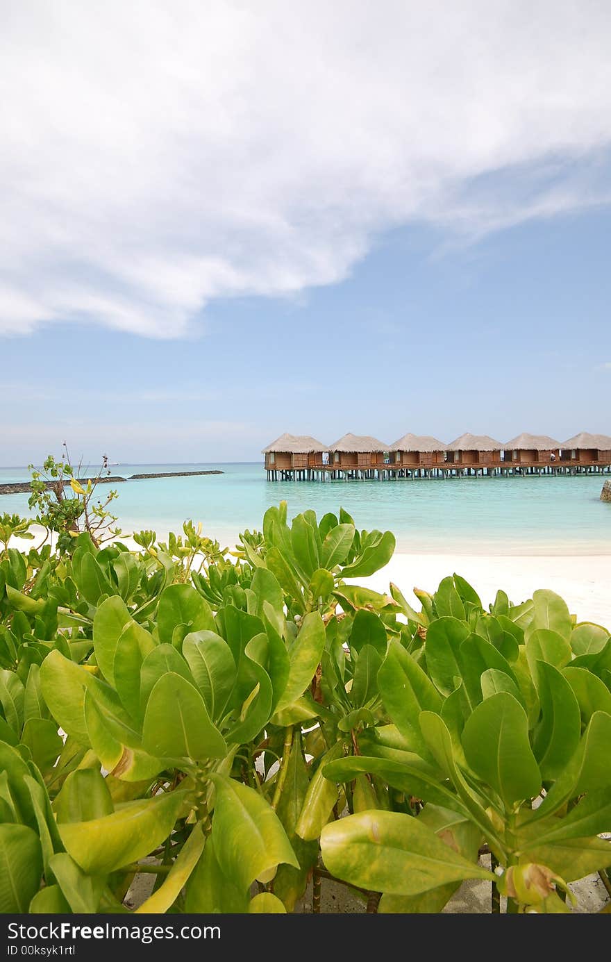 Looking at water suites on beach on the north side of Full Moon Island, Maldives