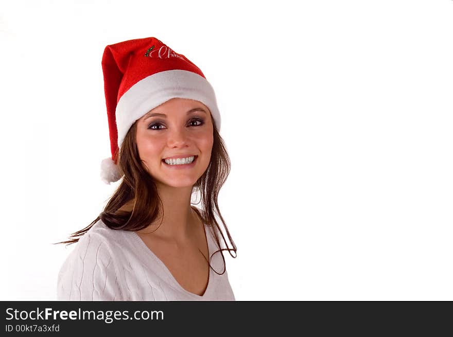 A pretty girl in a Santa hat, isolated on white. A pretty girl in a Santa hat, isolated on white.