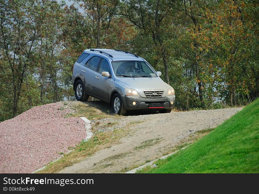 Offroad car moving on the hill. Offroad car moving on the hill