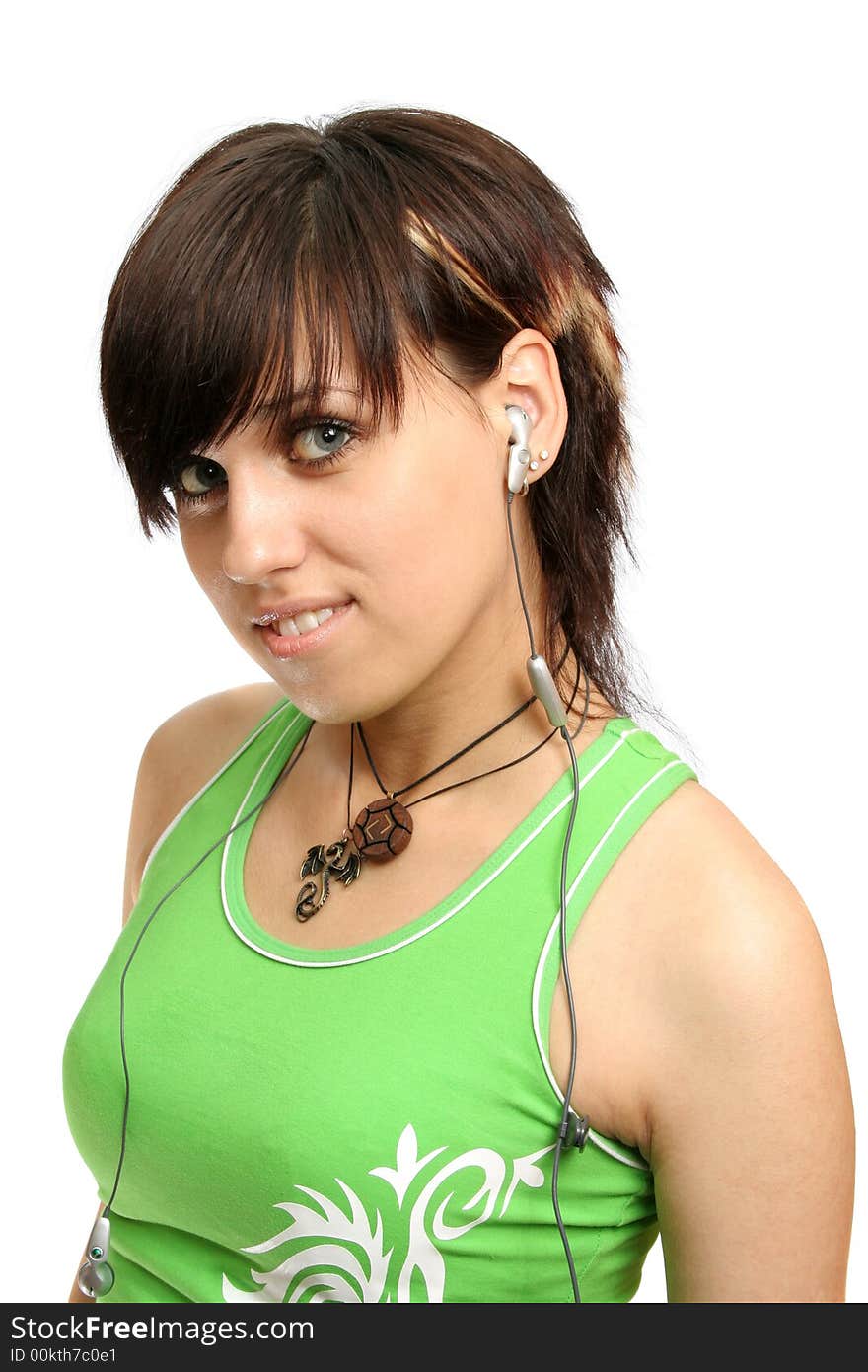 A smiling young girl with mobile's headphones, isolated on white