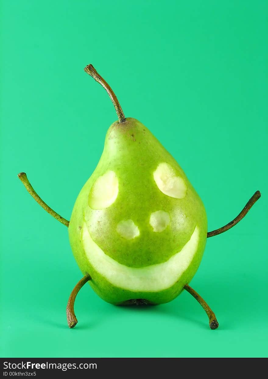 Abstract composition: cheerful pear on green background