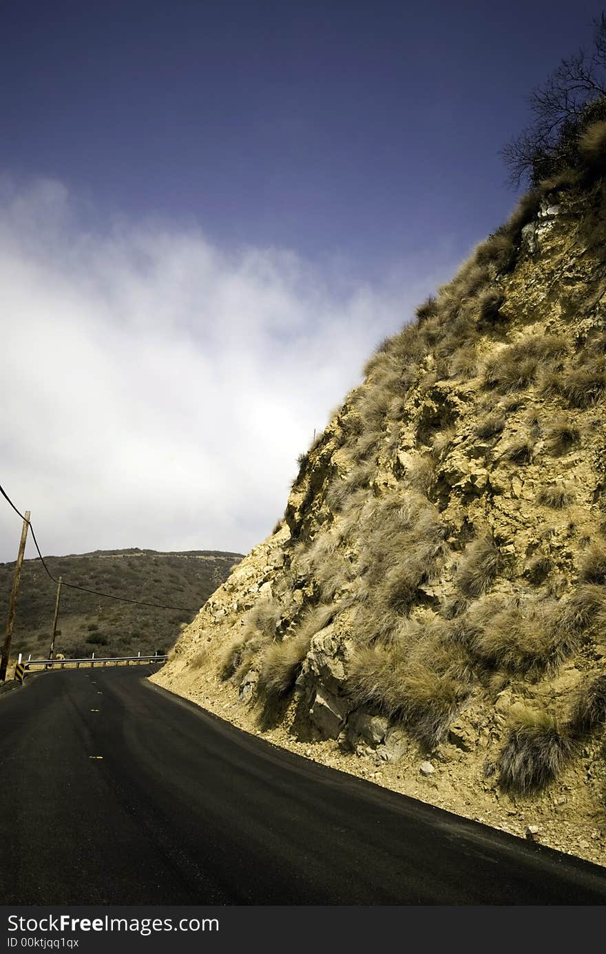 Contrasting colors wrap around this blacktopped road. Contrasting colors wrap around this blacktopped road