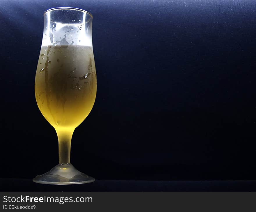 White wine on the black background