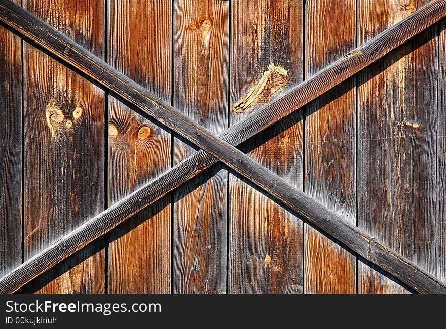 Old scratched wooden brown background. Old scratched wooden brown background