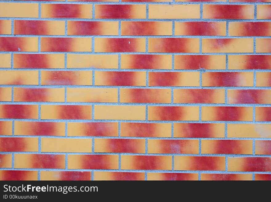 Brick wall with red-yellow gradient color bricks. Brick wall with red-yellow gradient color bricks