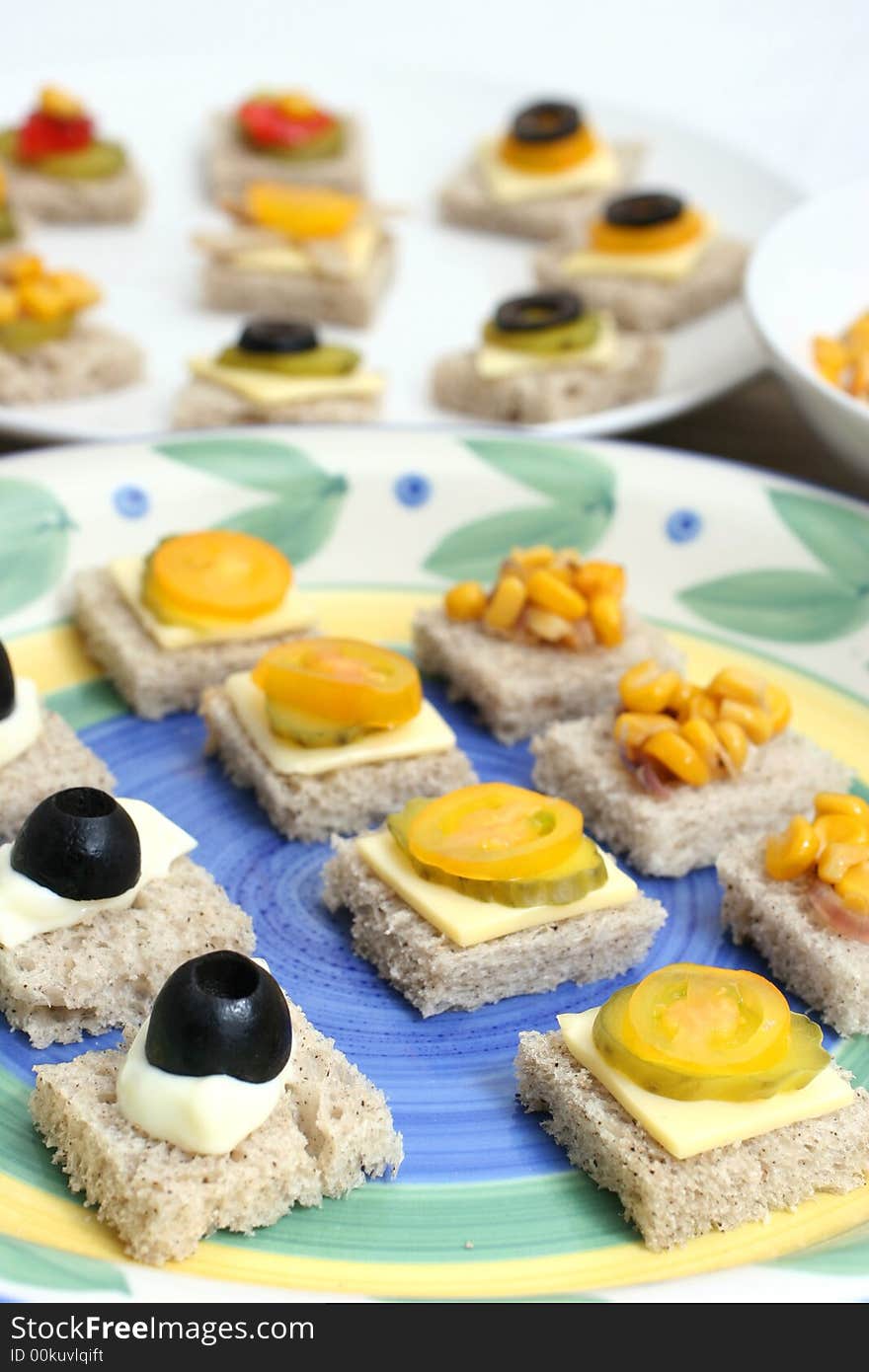 Fruit and vegetable canapes on a white ceramic plate