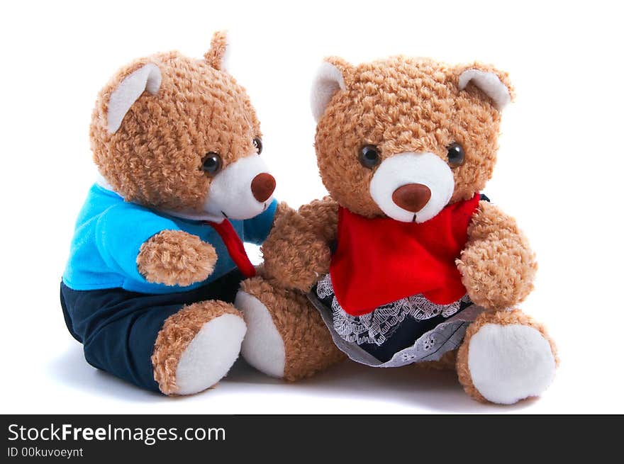 Teddy bears dress up as a couple, with shirt and tie and frilly dress. Boy teddy looking at girl teddy. Teddy bears dress up as a couple, with shirt and tie and frilly dress. Boy teddy looking at girl teddy.