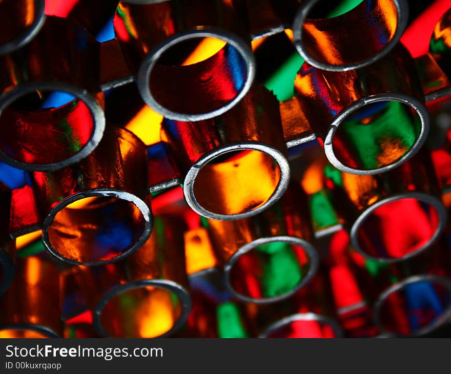 Abstract - metal circled structure in flashes of colorful light (red, yellow, green, blue). Abstract - metal circled structure in flashes of colorful light (red, yellow, green, blue).