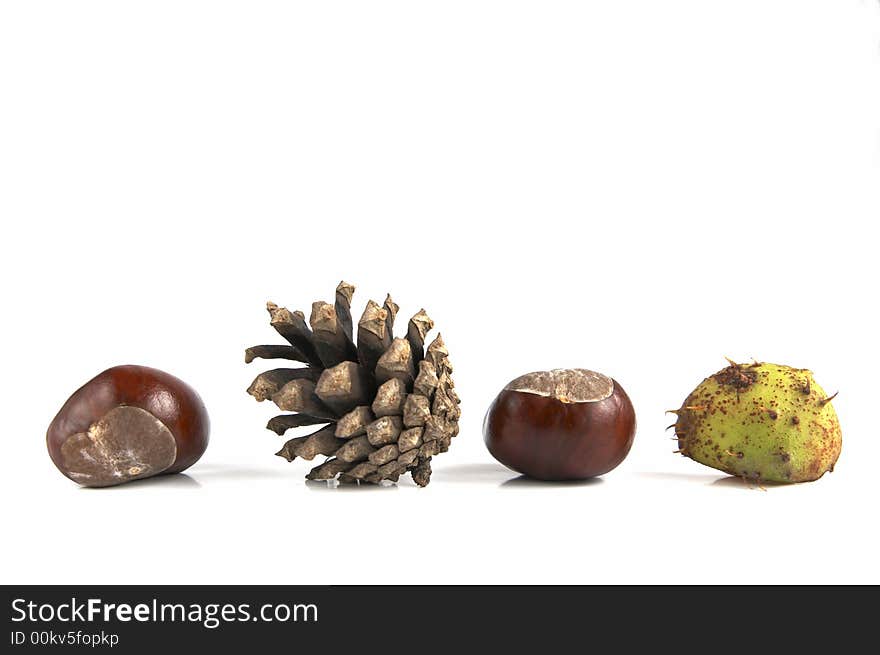 Composition of crone and chestnuts isolated on white background