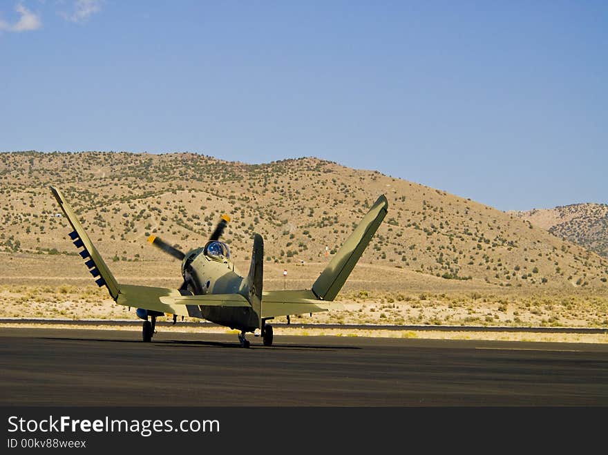 Vintage war bird fighter aircraft on the runway. Vintage war bird fighter aircraft on the runway