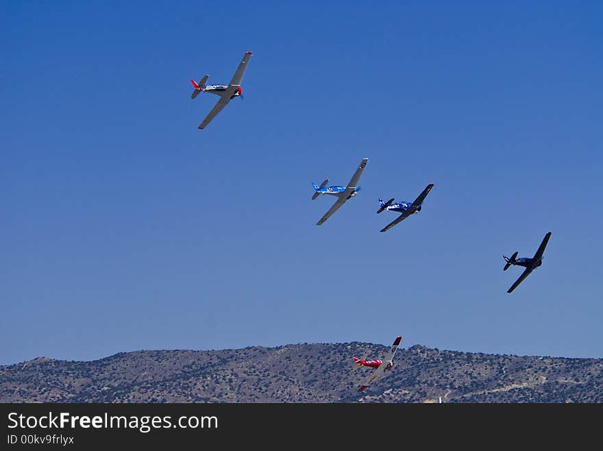 Vintage war bird fighter aircraft in flight at the Reno Air Races. Vintage war bird fighter aircraft in flight at the Reno Air Races