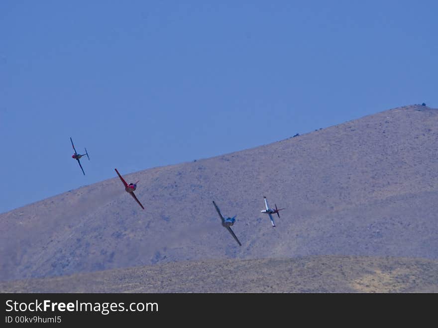 Vintage war bird fighter aircraft in flight at the Reno Air Races. Vintage war bird fighter aircraft in flight at the Reno Air Races