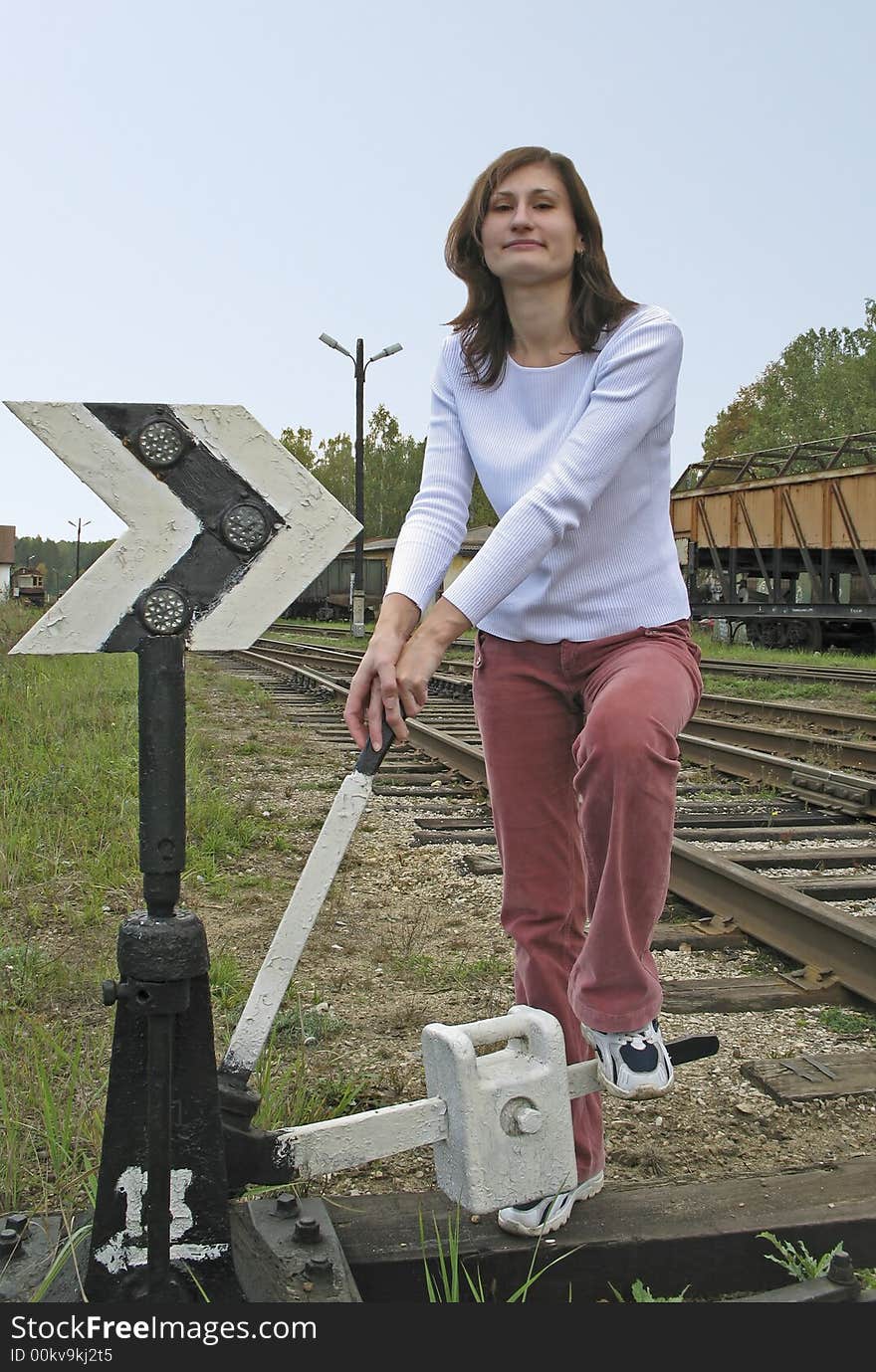 Young girl taken pictures on background of the subject of the railroad. Young girl taken pictures on background of the subject of the railroad