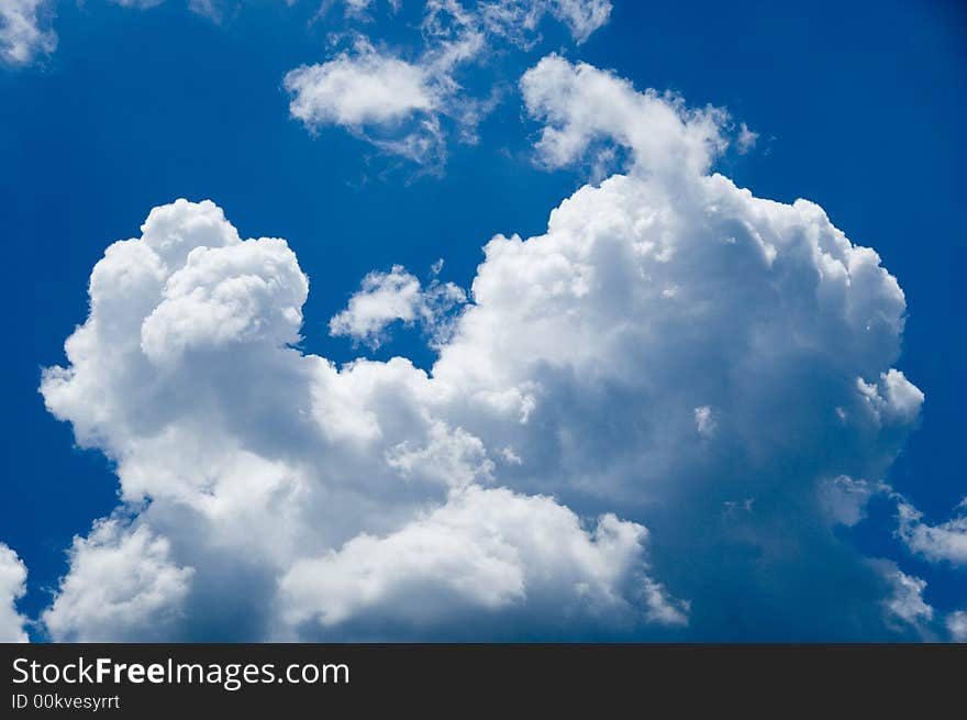 A brilliant blue sky with clouds. A brilliant blue sky with clouds