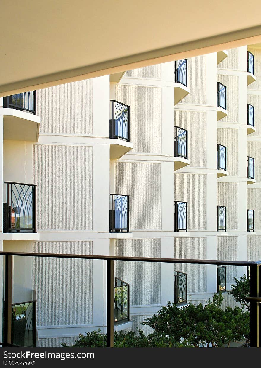 Repetetive geometric angled balconies and neutral concrete walls