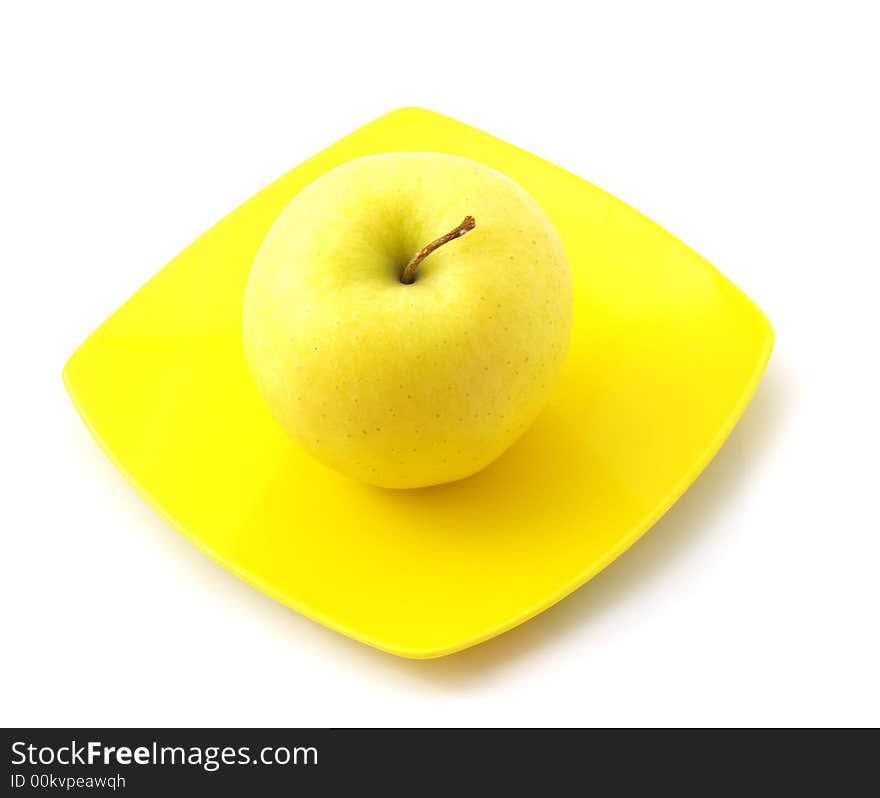 Yellow Apple On The Dish