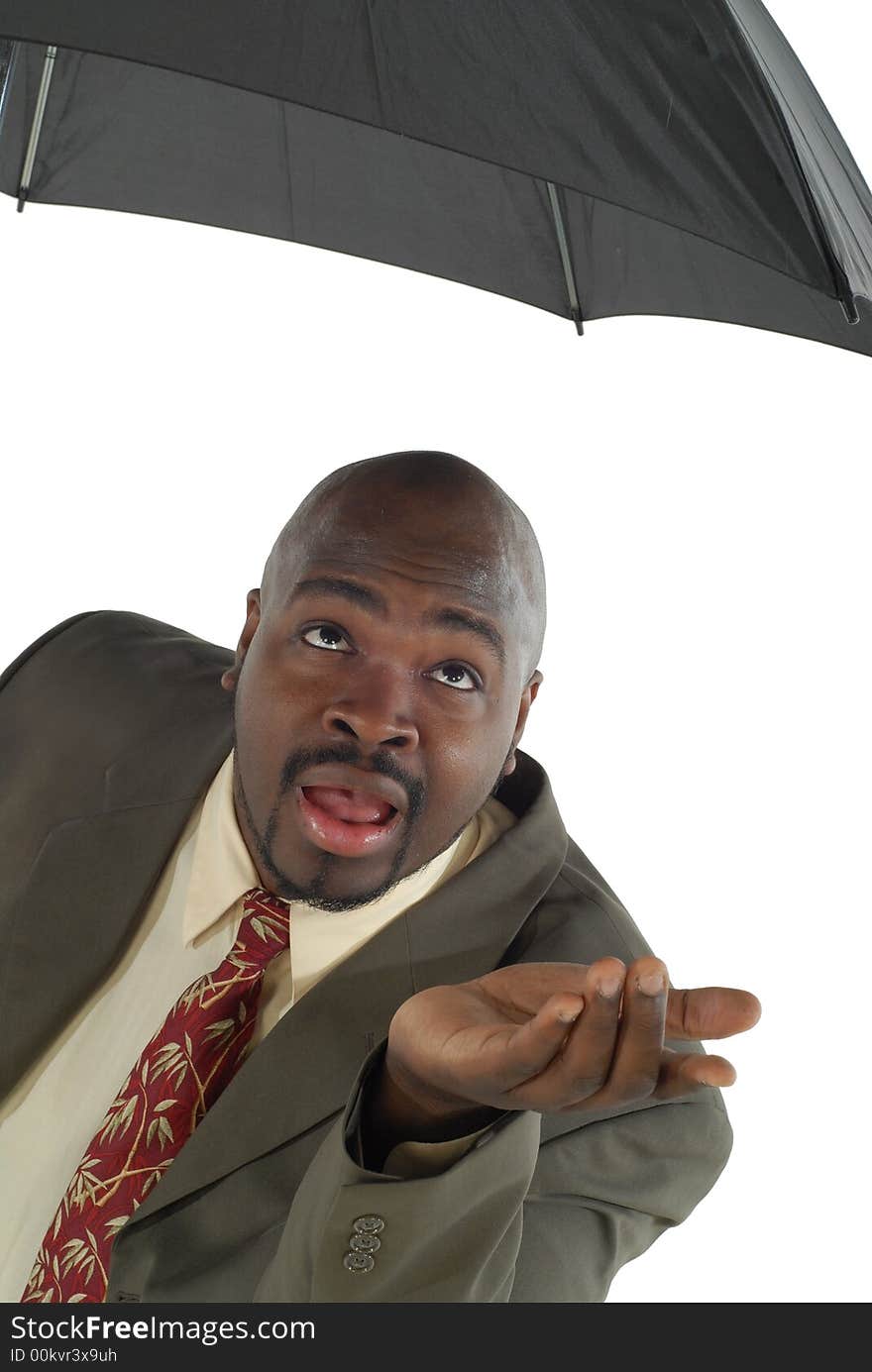 Rainy day has come sooner than expected; nervous and scared businessman is peeking out from his umbrella to see if it is all right to come out. Rainy day has come sooner than expected; nervous and scared businessman is peeking out from his umbrella to see if it is all right to come out