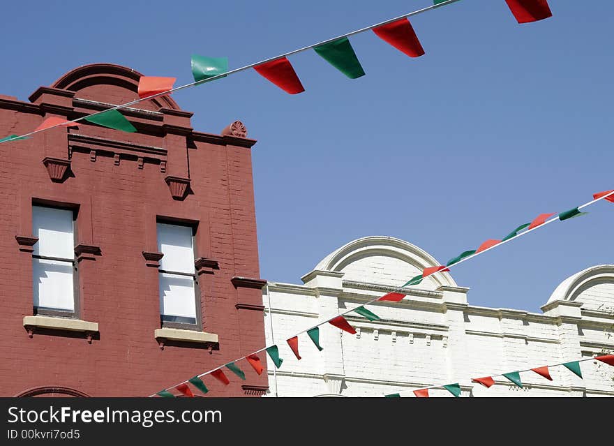 Urban Building Facade, Red And Green Flags As Decoration