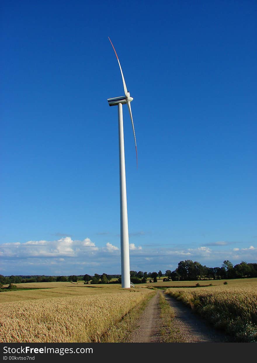 Wind turbine on a hilly field